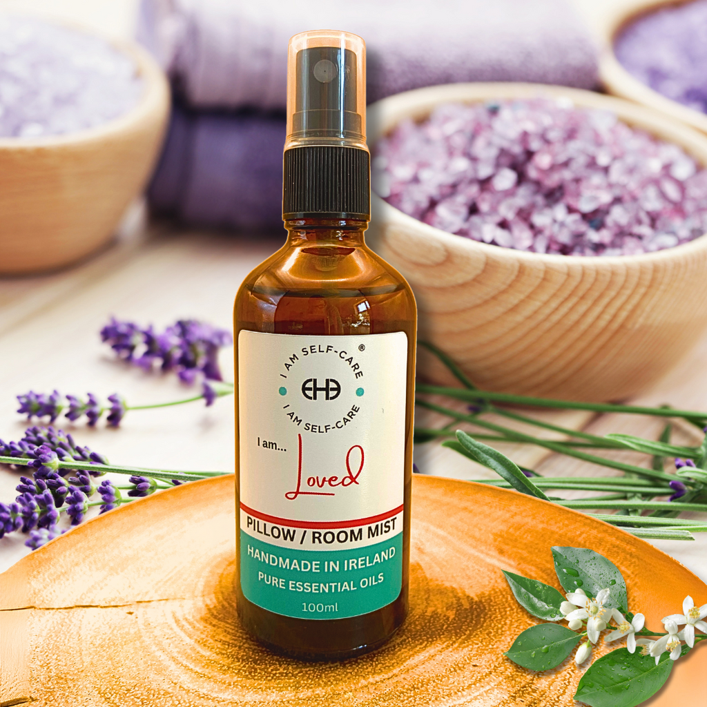 Bottle of pillow/room mist or pillow spray with lavender and wooden bowls in the background