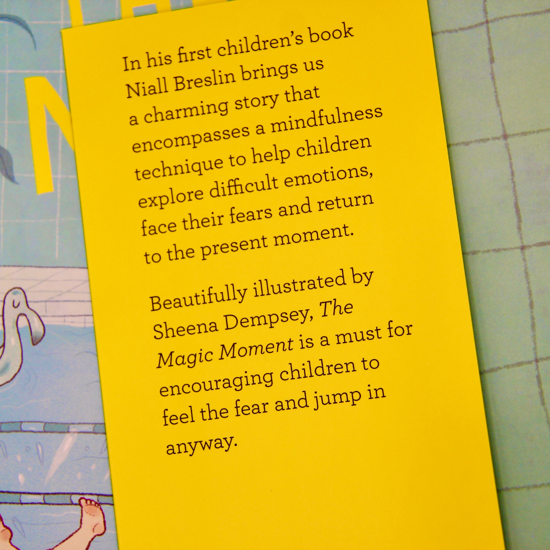 Book review of 'The Magic Moment' by Niall Breslin with text on a yellow background.