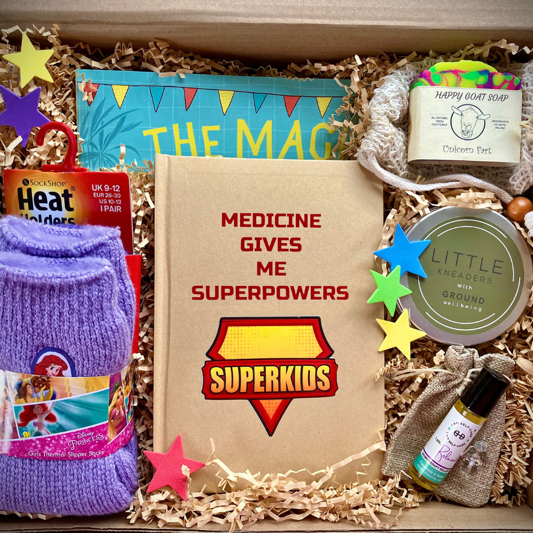 Gift box with 'Superkids' themed items including a notebook and soap.