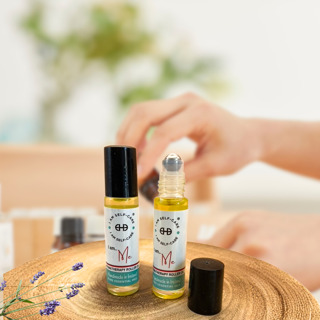 Two self-care rollerball  for anxiety bottles on a wooden surface with blurred background