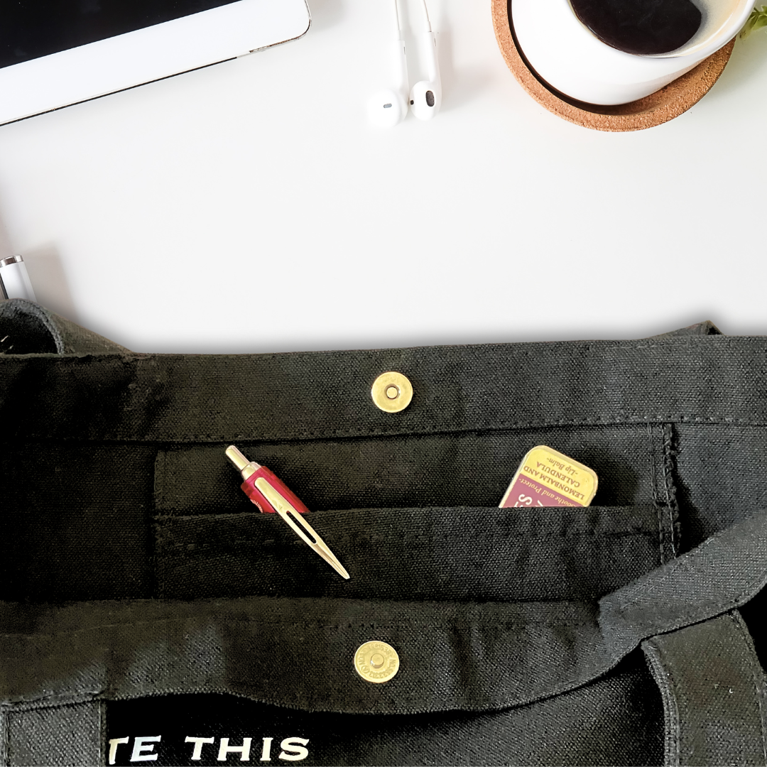 Inside of black tote bag showing inside pocket