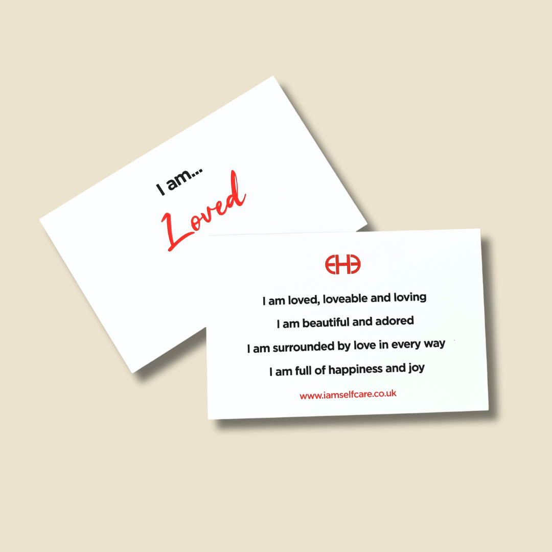 Two I Am Loved affirmation cards with  on a beige background