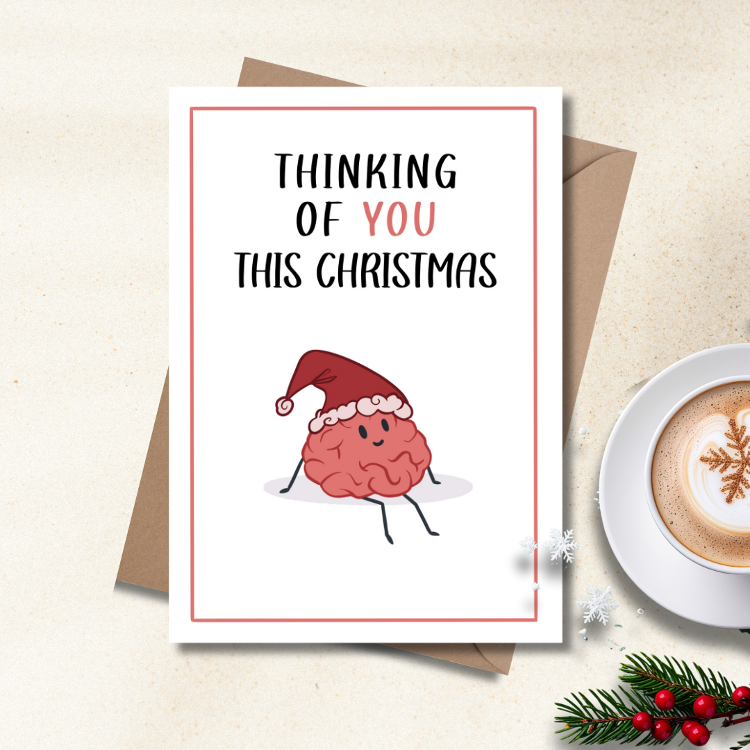 Thinking of you this Christmas card with cartoon brain wearing a santa hat