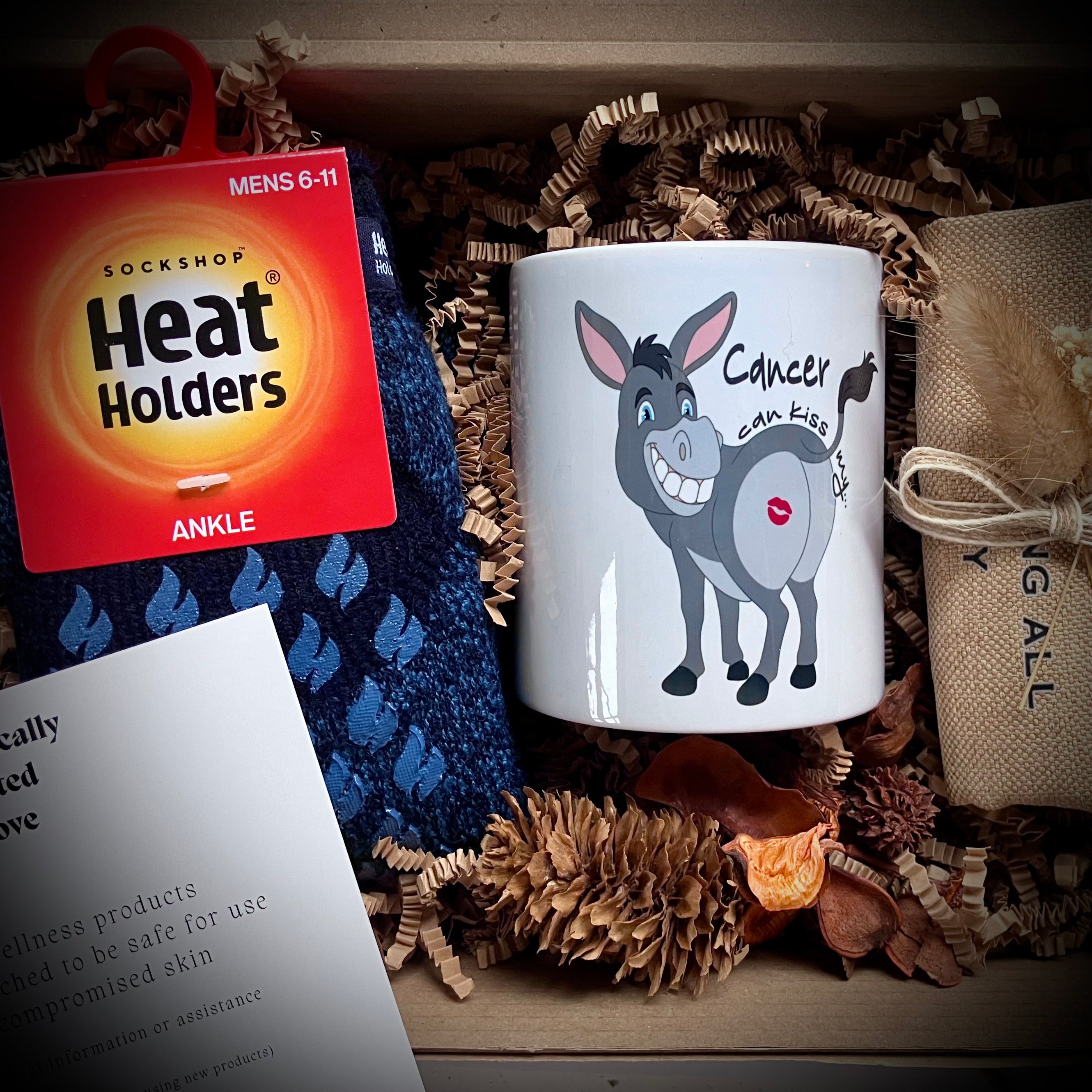 Cancer mug with donkey design and mens non slip socks in a care package