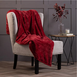 Thermal blanket in cranberry over chair