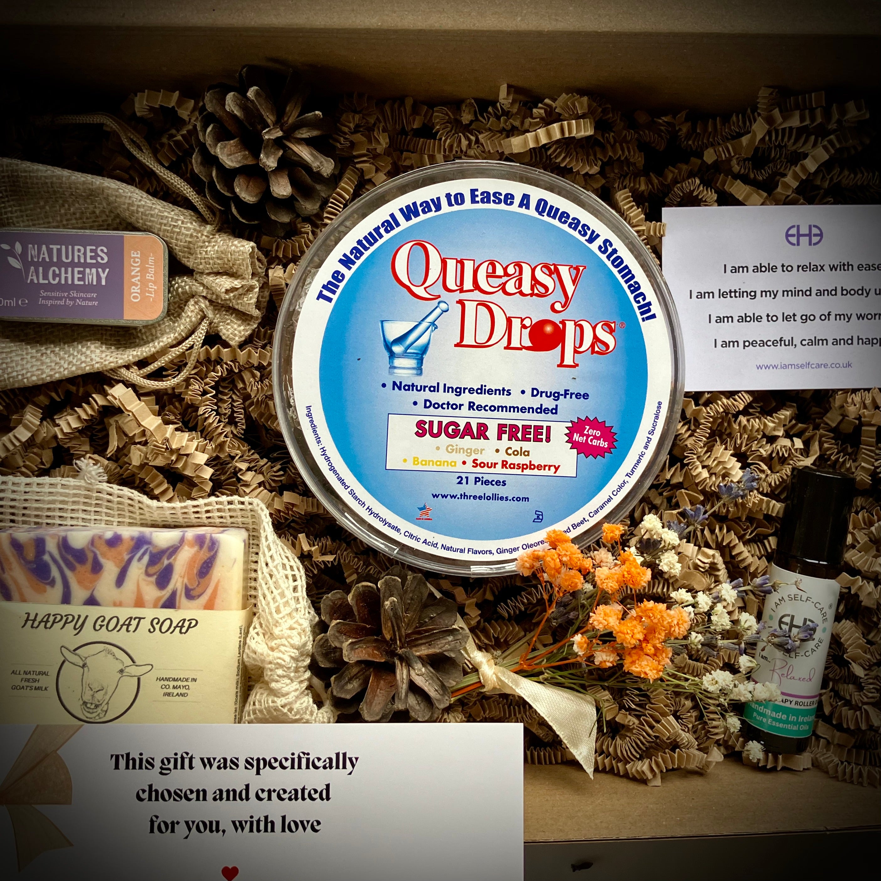 Box of Queasy Drops  with organic lip balm, goats milk soap and aromatherapy oil in a gift box as a care package